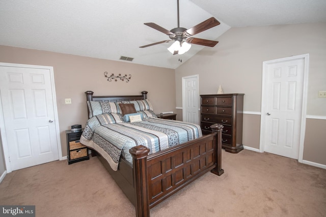 bedroom with light carpet, lofted ceiling, and ceiling fan