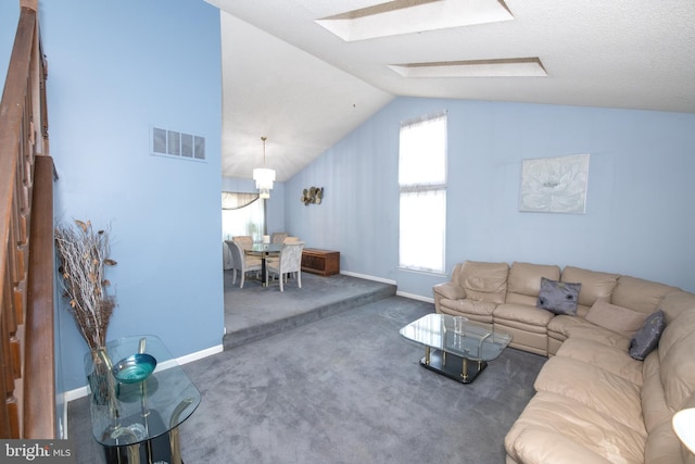 unfurnished living room featuring lofted ceiling and dark carpet