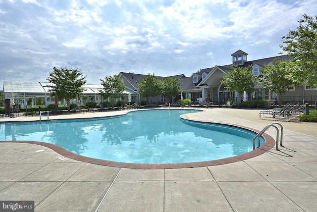 view of pool featuring a patio