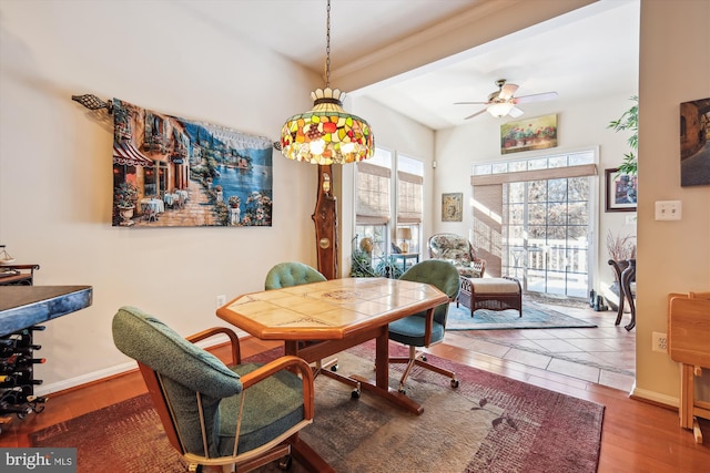 dining area featuring hardwood / wood-style flooring and ceiling fan