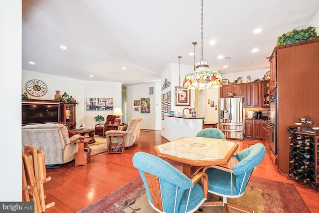 dining area with light wood-type flooring