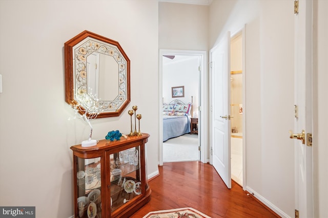 hallway featuring hardwood / wood-style flooring