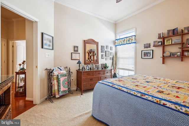 bedroom with carpet flooring and ornamental molding