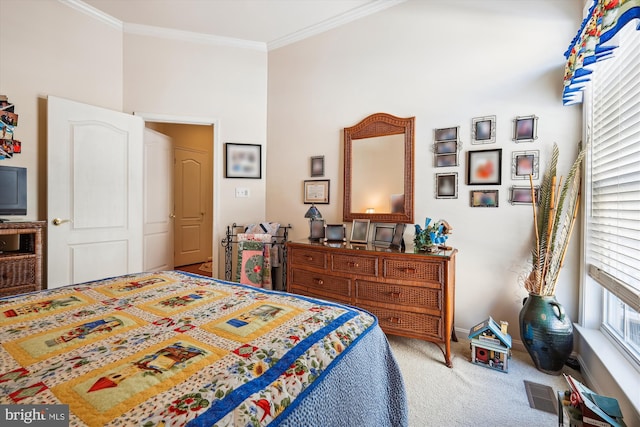 bedroom with crown molding and carpet flooring