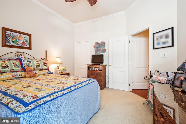 bedroom with crown molding, carpet floors, and ceiling fan