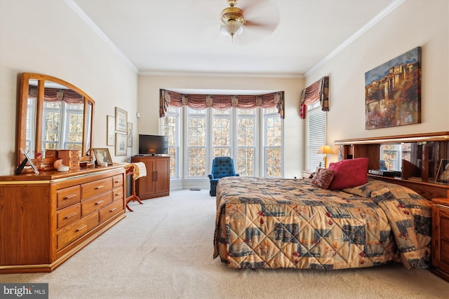 bedroom with ceiling fan, crown molding, and light carpet