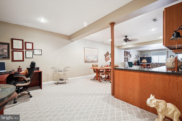 home office with light carpet and ceiling fan