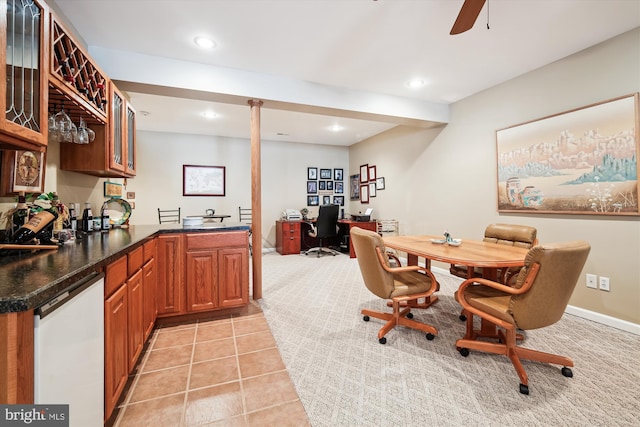 dining space with ceiling fan and light tile patterned flooring