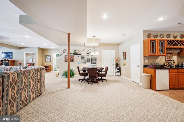 interior space featuring bar area and light colored carpet