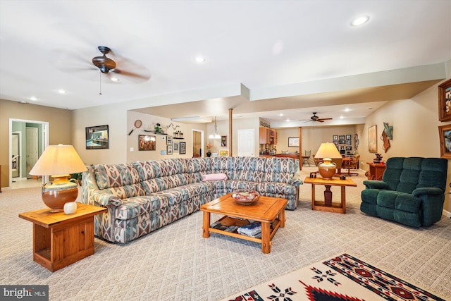 living room with ceiling fan and light carpet