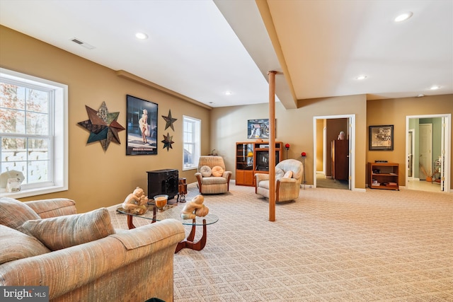 living room with light colored carpet and a wealth of natural light