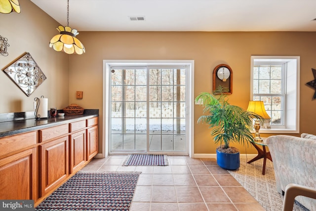 doorway featuring light tile patterned floors