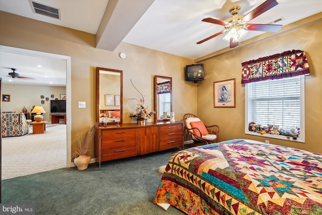 carpeted bedroom with ceiling fan and beam ceiling