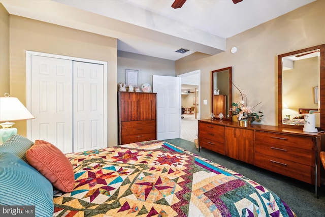 carpeted bedroom featuring ceiling fan and a closet