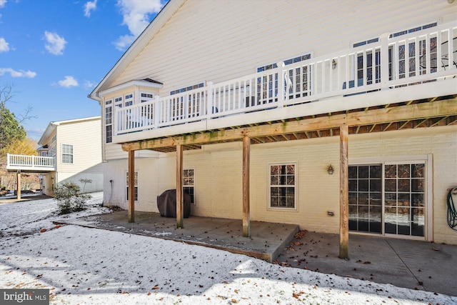 back of property with a wooden deck