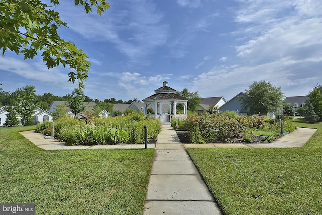 view of property's community featuring a gazebo and a lawn