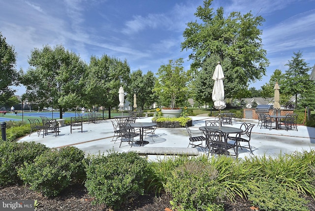 view of patio with tennis court