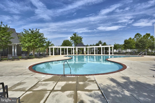 view of pool featuring a patio and a pergola