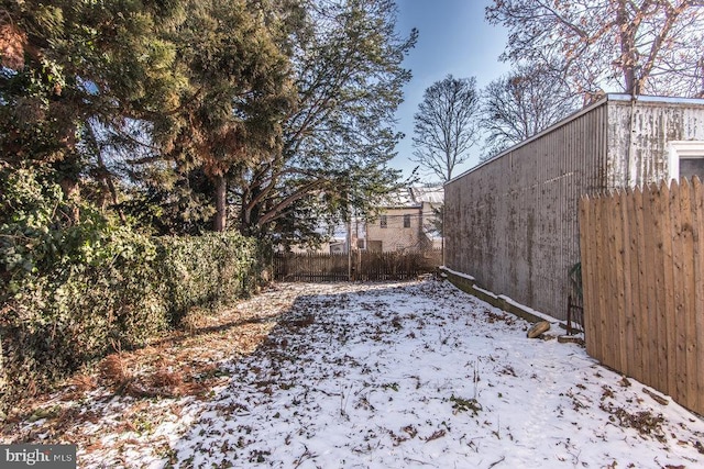 view of yard layered in snow