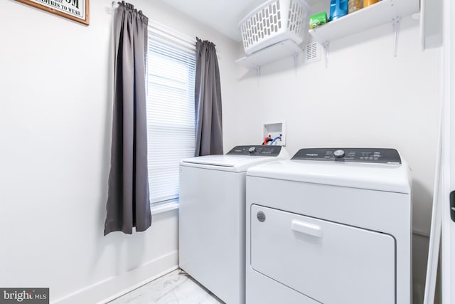 laundry room with washing machine and dryer