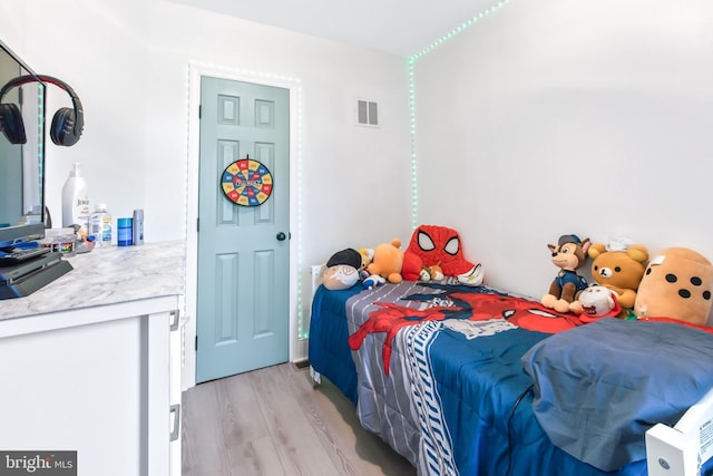 bedroom with light hardwood / wood-style floors