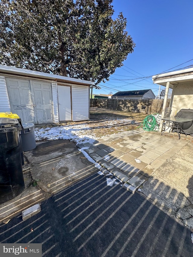 view of patio / terrace with a shed