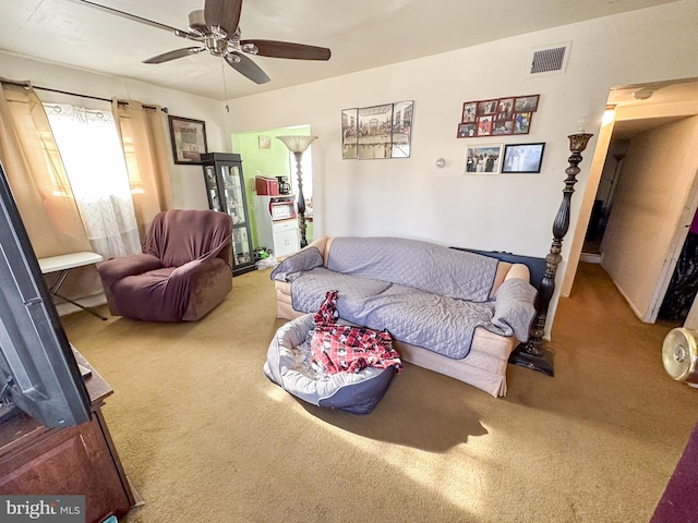 living room with carpet floors and ceiling fan