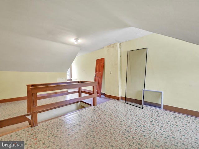 bonus room featuring vaulted ceiling