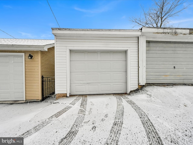 view of snow covered garage