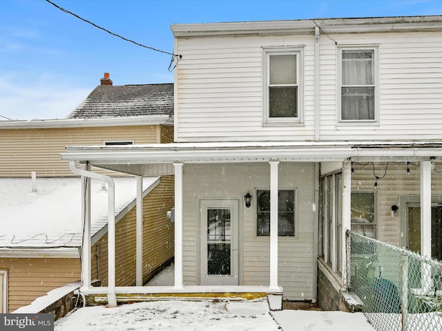 view of snow covered house