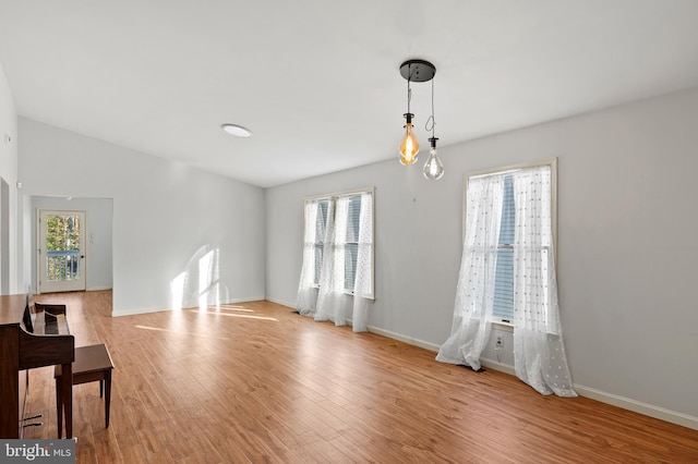 empty room with a healthy amount of sunlight and light wood-type flooring