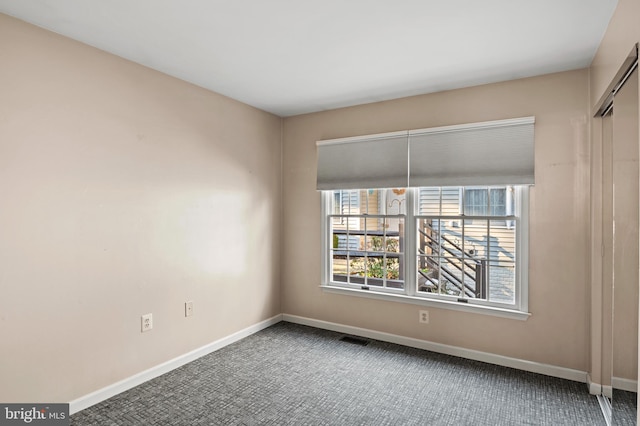 view of carpeted spare room