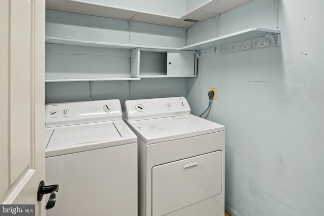 laundry area featuring washing machine and dryer