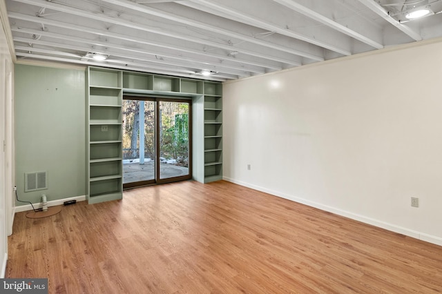 spare room featuring hardwood / wood-style floors