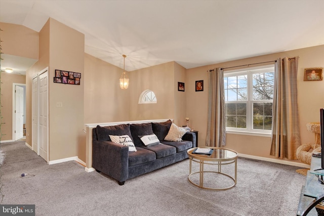 living room featuring vaulted ceiling and carpet floors