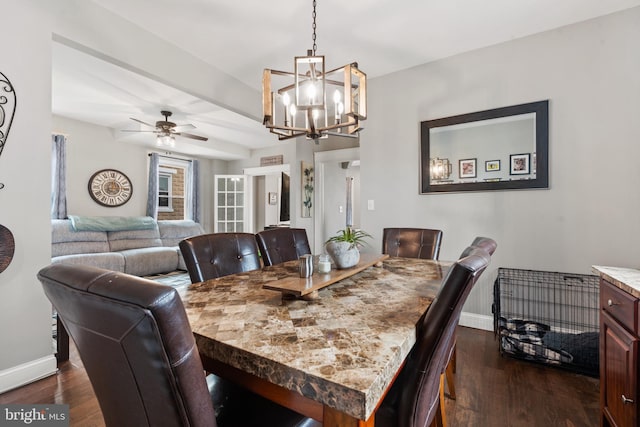 dining area with dark hardwood / wood-style floors and ceiling fan with notable chandelier