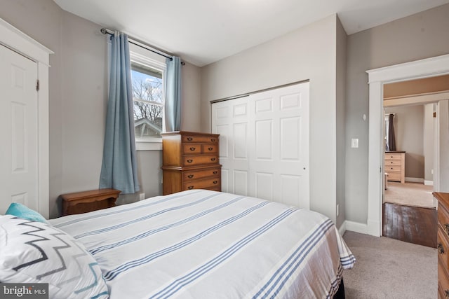 carpeted bedroom with a closet