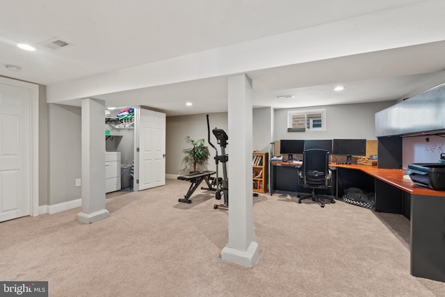 carpeted home office featuring washer / dryer