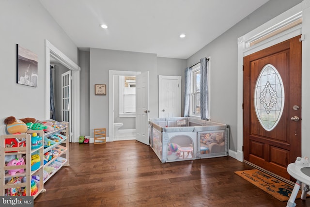 foyer with dark hardwood / wood-style floors