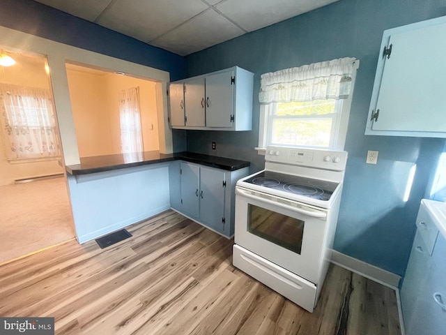 kitchen with white cabinetry, light hardwood / wood-style floors, dishwasher, white electric stove, and a drop ceiling