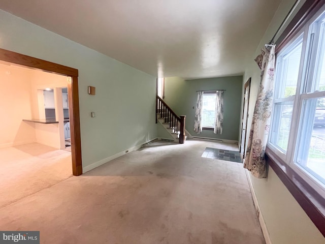 interior space featuring light colored carpet