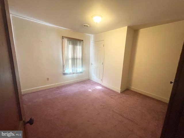 spare room with carpet floors