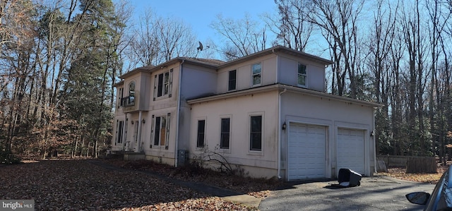 view of property exterior with a garage