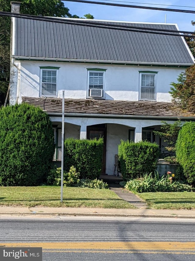 view of front property with cooling unit