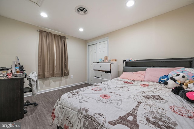 bedroom featuring dark hardwood / wood-style floors