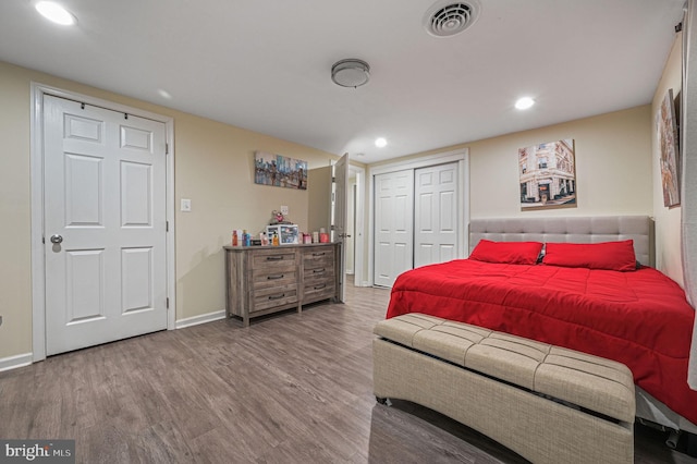 bedroom with a closet and hardwood / wood-style flooring