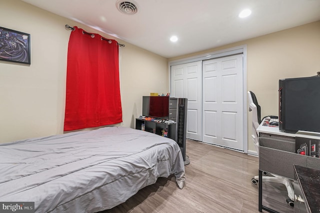 bedroom featuring a closet and hardwood / wood-style floors