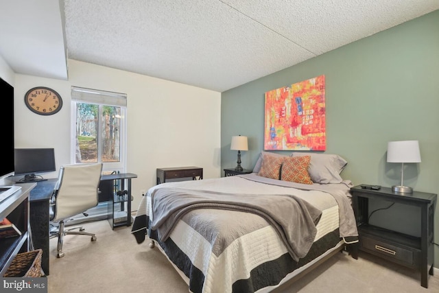 bedroom with light colored carpet and a textured ceiling