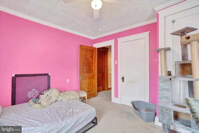 bedroom with ceiling fan, light carpet, and ornamental molding