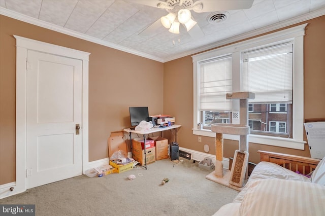 home office featuring ceiling fan, carpet, and ornamental molding